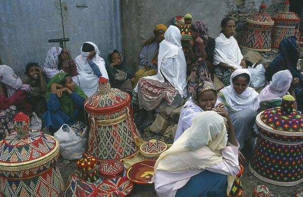 20066195. ETHIOPIA Gonder Women selling colourful woven baskets at market. Colorful Gondar