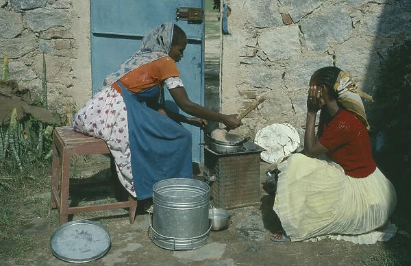20070737. ERITREA Afabet Women cooking over charcoal