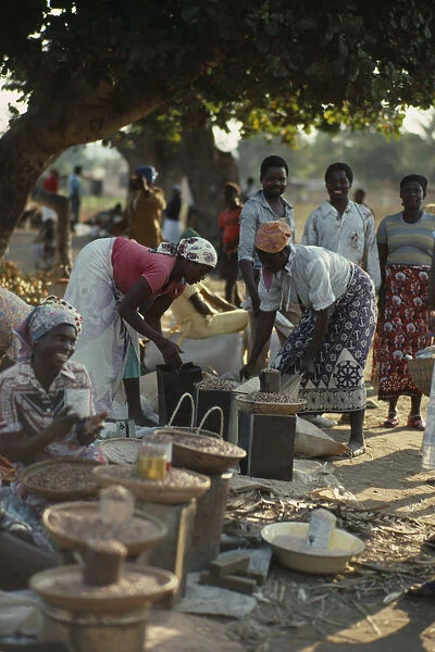 20074285. MOZAMBIQUE Maxixe Women selling beans and pulses at street market