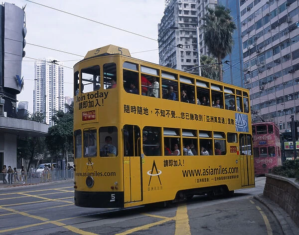 CHINA, Hong Kong, Transport Hong kong Island tram with passengers on top deck looking