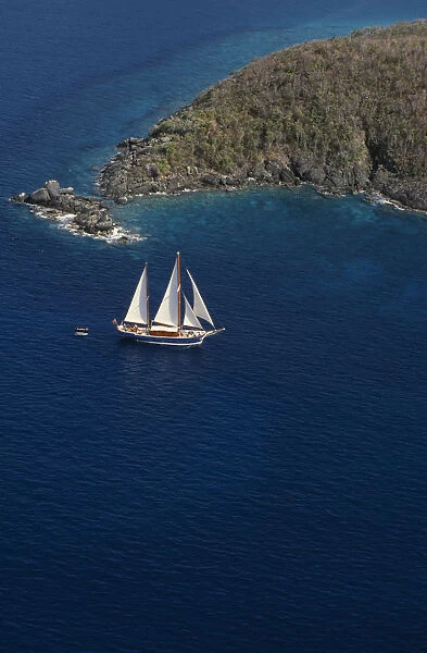 WEST INDIES, US Virgin Islands, St Thomas Elevated view over sailing boat passing