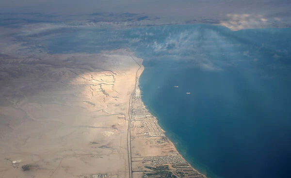 An aerial view of the coast of the Red Sea is pictured through the window of an airplane