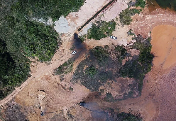 An aerial view shows machines being destroyed during an operation conducted by the
