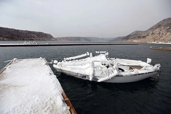 A boat covered in ice is seen in Bakarac