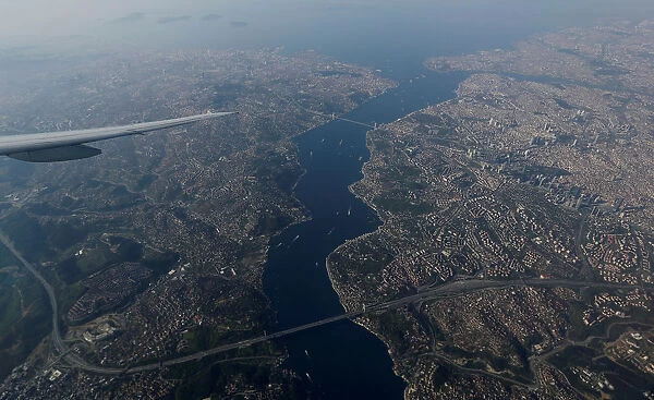 The Bosphorus strait is pictured through the window of a passenger aircraft over Istanbul