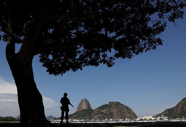 Brazilian Marine patrols Botafogo neighbourhood with Sugarloaf Mountain in background in