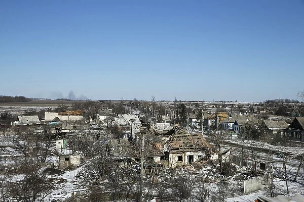 Buildings damaged by fighting are pictured in the village of Nikishine