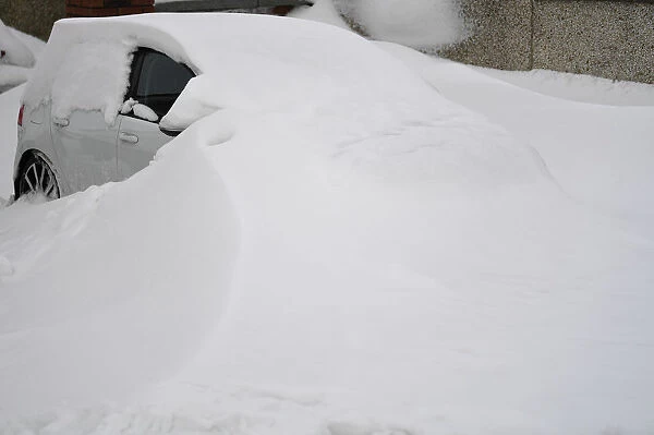 A car is submerged in snow near Dublin