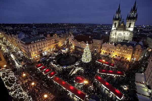 A Christmas tree is illuminated as the traditional Christmas market opens at the Old