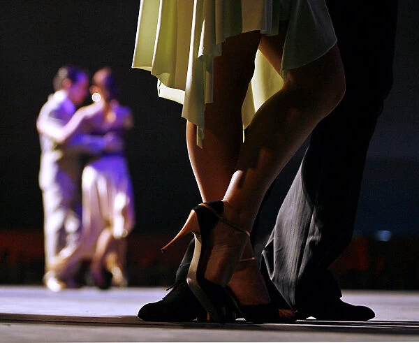 Couples dance in the final round of the tango in the Tango Dance World Championship