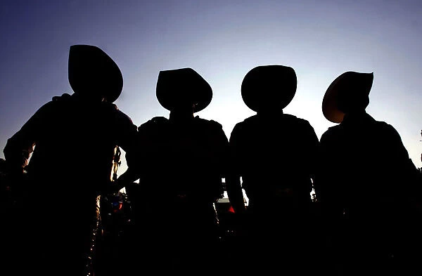 Cowboys are silhouetted during the Barretos Rodeo International Festival in Barretos