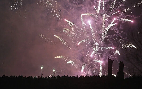 Fireworks explode over the medieval Charles Bridge in Prague