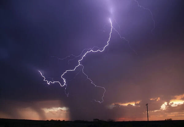 Huge lightning strikes cross the skies as thunderstorms supercells pass through areas