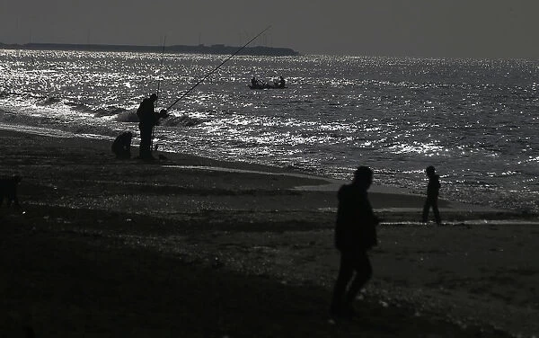 Palestinians fish at the sea near Rafah in the southern Gaza Strip