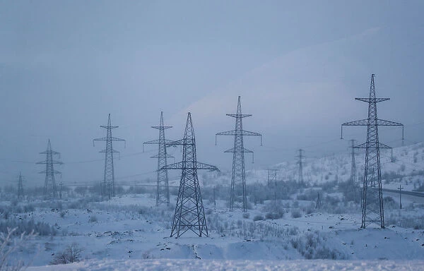 Power transmission lines are seen on a frosty day outside the town of Monchegorsk in