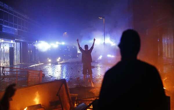 Protester gestures towards police during demonstrations at the G20 summit in Hamburg