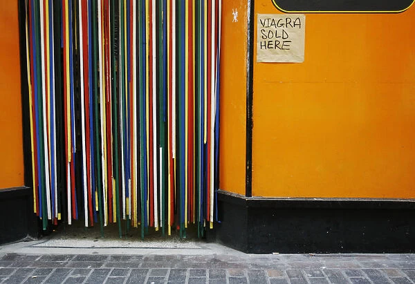 A sign advertising Viagra is seen outside a sex shop in the Soho district of central