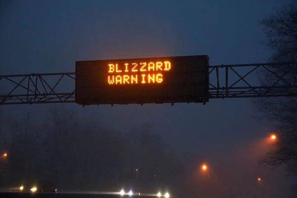A sign reading Blizzard Warning is seen above the Northern State Parkway near Westbury
