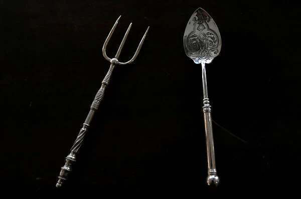 Silver plated cutlery is seen for sale at an antique store in Islamabad