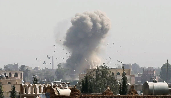 Smoke and debris rise from the site of a Saudi-led air strike in Sanaa