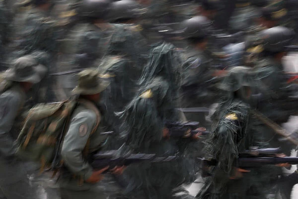Soldiers take part in a military parade to celebrate the 207th anniversary of Venezuela s