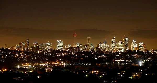 Sydneys central business district lights up after sunset as Australias largest city