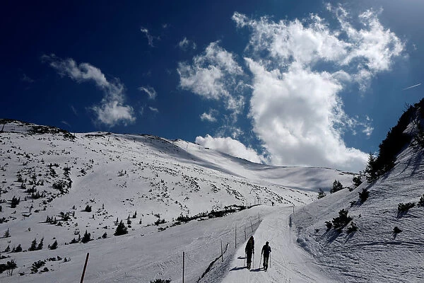 Tourists walk up, as they are ski touring on Kasprowy Wierch
