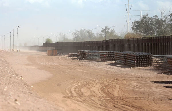 View of the 30-foot high bollard style wall at US-Mexico border to replace a section near