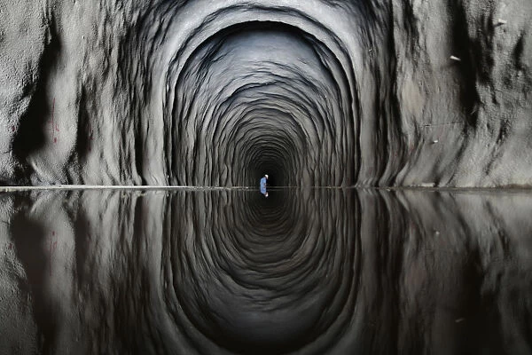 A worker is seen inside the Cuncas II tunnel near Mauriti