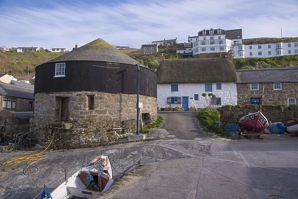 Coastal village with The Roundhouse (old capstan house), Sennen Cove, Sennen, Cornwall, England, May