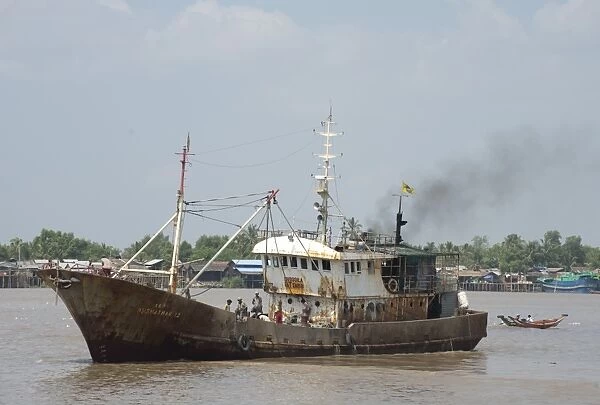 Dilapadated old ship on river, Yangon, Myanmar, March