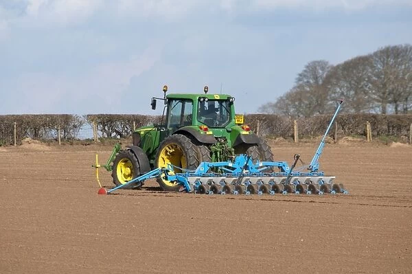 John Deere tractor with seed drill, drilling sugar beet, Nesscliffe, Shropshire, England, march