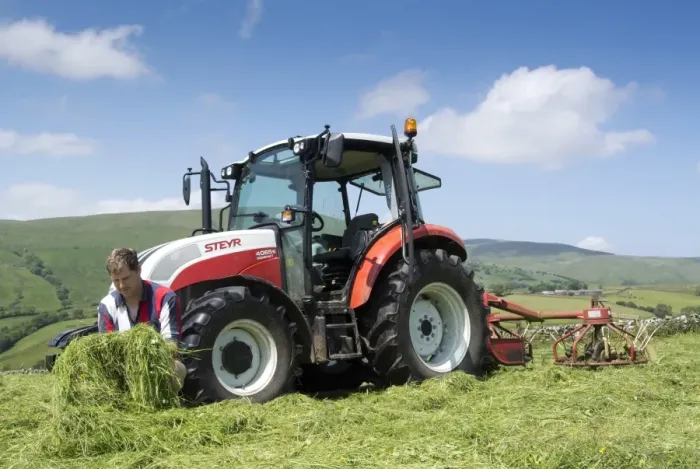 Framed Print : Farmer checking mown grass quality, beside Steyr tractor with tedder, Print Framed Print : Farmer checking mown grass quality, beside Steyr tractor with tedder, Print