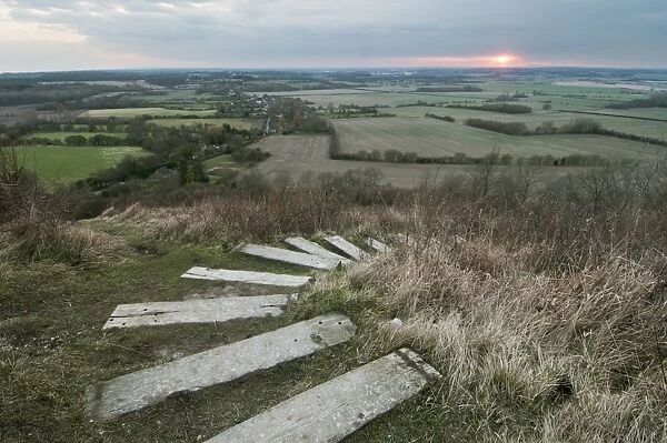 Steps leading from The Devils Kneading Trough at sunset, looking towards Ashford, Wye Downs, North Downs, Kent