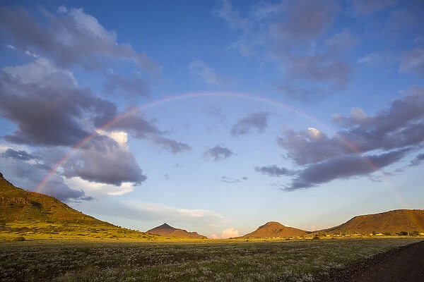 Africa, Namibia. Landscape with full rainbow
