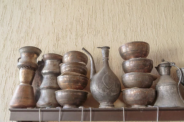 Azerbaijan, Lahic. A collection of engraved bowls and kettles