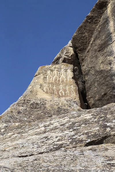 Azerbaijan, Qobustan. Petroglyphs of people carved into a stone at Gobustan National Park