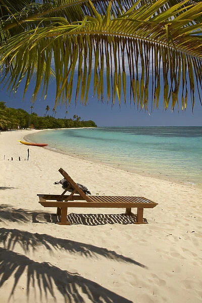 Beach, palm trees and lounger, Plantation Island Resort, Malolo Lailai Island, Mamanuca Islands