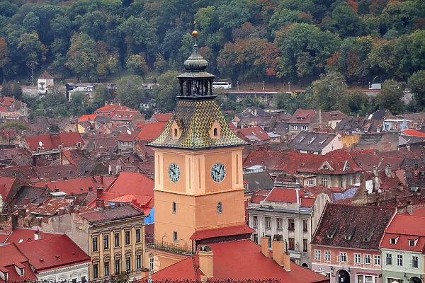 Brasov, Romania. Rooftops and city from hilltop. Clock tower