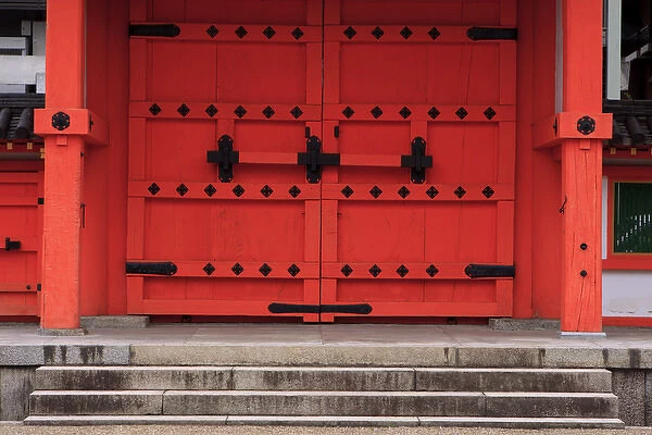 A bright red door in the grounds of the Sanjuusangendo Temple in Kyoto, Japan