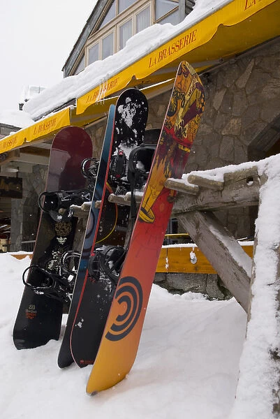 CA, BC, Whistler Village. Snowboards outside cafe in fresh snow