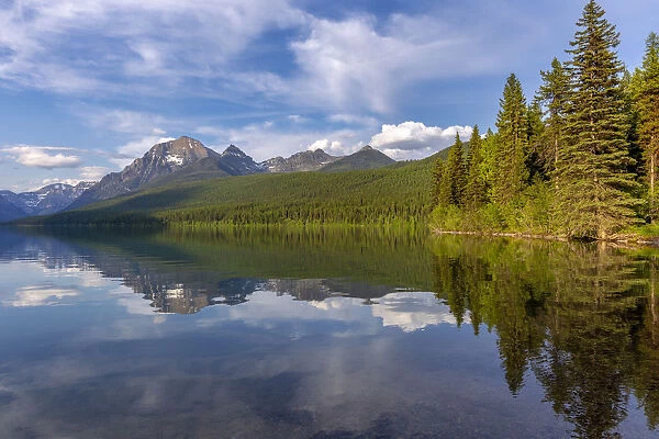 Calm reflection on Bowman Lake in Glacier National Park, Montana, USA