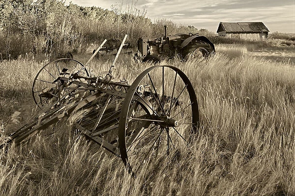 Canada. Black and white of old farm machinery in field