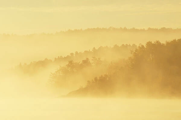 Canada, Ontario, Whitefish. Fog along the Vermillion River at sunrise. Credit as