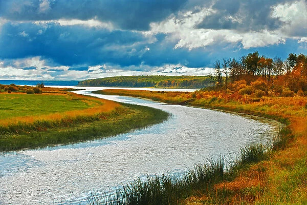 Canada, Saskatchewan, Green Lake. River and storm clouds
