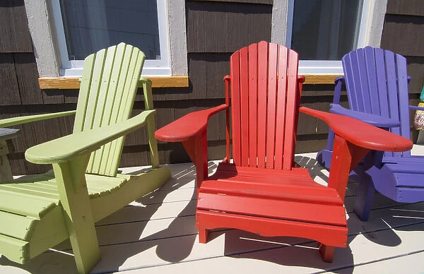 Canada St Martins New Brunswick colorful home with colorful Adirondack chairs on porch