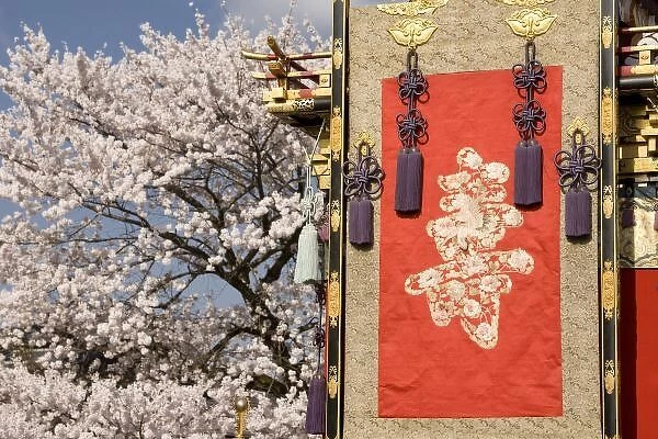 Cherry blossom tree and silk tapestry of elaborate festival float (yatai) in Gonjunko