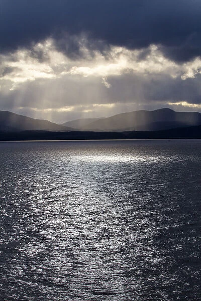 Chile, Patagonia, Strait of Magellan. Tierra del Fuego, rays of sunshine over the fjords