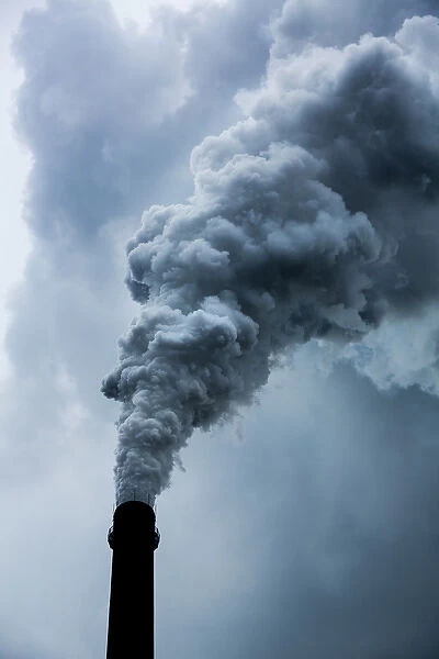 China, Chongqing, Steam and smoke billows from smokestacks at massive coal-fired