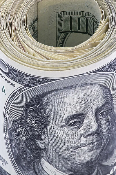 Close-up of a roll of US $100 bills. Credit as: Dennis Flaherty  /  Jaynes Gallery  /  DanitaDelimont